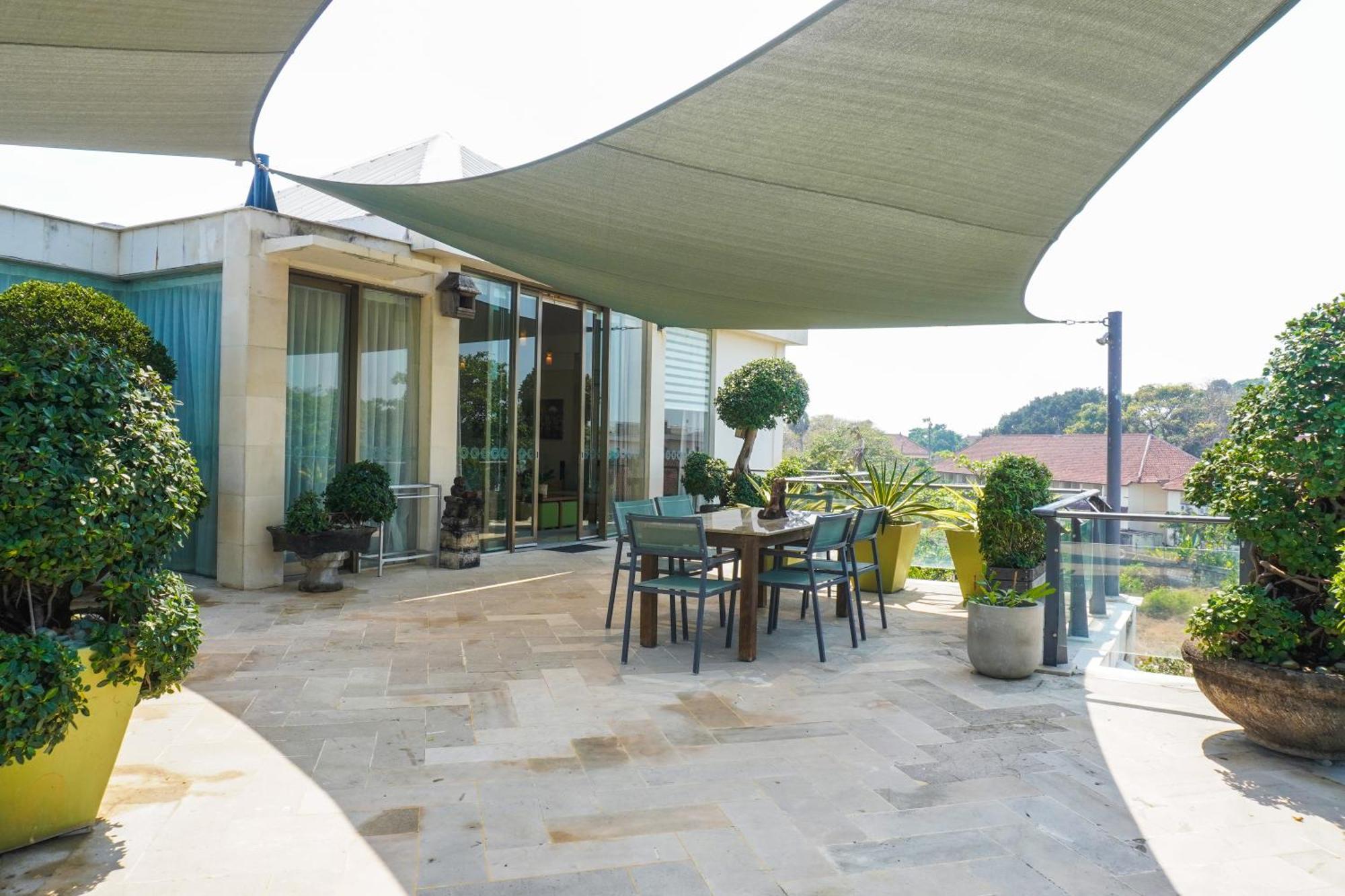 Furamaxclusive Ocean Beach Seminyak Bali Legian  Exterior photo A sail shade