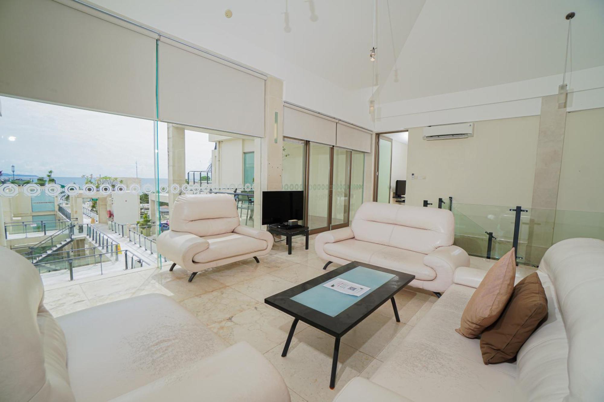 Furamaxclusive Ocean Beach Seminyak Bali Legian  Exterior photo A living room in a penthouse apartment